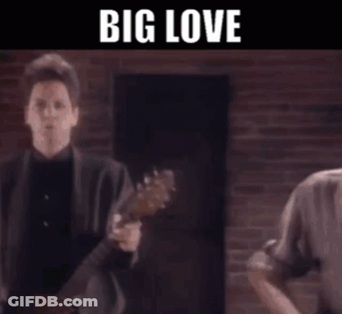 A Group Of Men Are Playing Guitars On A Stage With The Words Big Love Written On The Bottom . GIF