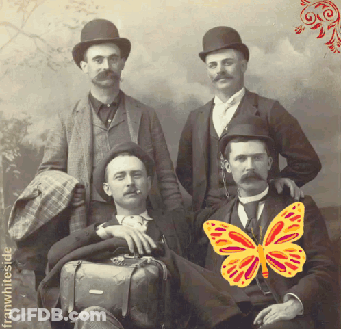 A Group Of Men Are Posing For A Photo With A Butterfly On Their Shoulder GIF