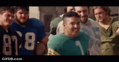 A Group Of Men Are Posing For A Picture And One Of Them Is Wearing A Jersey With The Number 78 On It . GIF