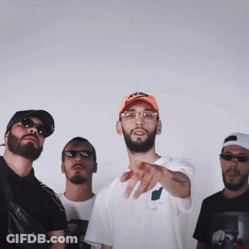 A Group Of Men Are Posing For A Picture With One Wearing A Hat That Says Nike GIF