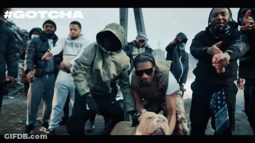 A Group Of Men Are Posing For A Picture With The Word Gotcha On The Bottom GIF