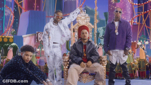 A Group Of Men Are Posing In Front Of A Sign That Says B & J GIF