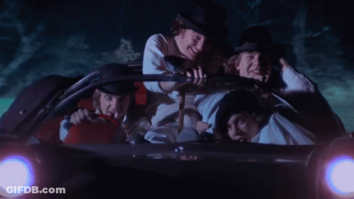 A Group Of Men Are Riding In A Car With A License Plate That Says Stay Alive GIF