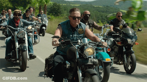 Men Riding Motorcycles Down Road With Sunglasses GIF