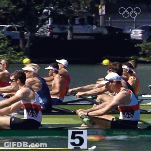 A Group Of Men Are Rowing A Boat With The Number 5 On The Front GIF
