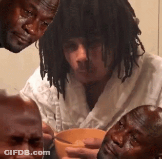 A Group Of Men Are Sitting Around A Bowl Of Soup And One Man Is Crying GIF