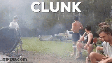 A Group Of Men Are Sitting Around A Campfire With The Word Clunk Written Above Them GIF