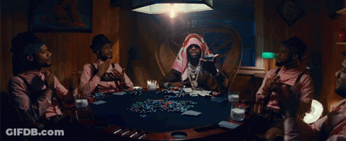A Group Of Men Are Sitting Around A Poker Table Playing Cards GIF