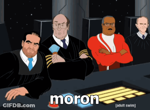 A Group Of Men Are Sitting At A Table And The Word Moron Is On The Bottom GIF