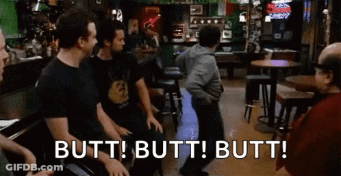 A Group Of Men Are Sitting At Tables In A Bar And A Man Is Dancing . GIF
