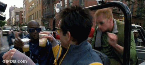 A Group Of Men Are Sitting In A Car Drinking And Eating GIF
