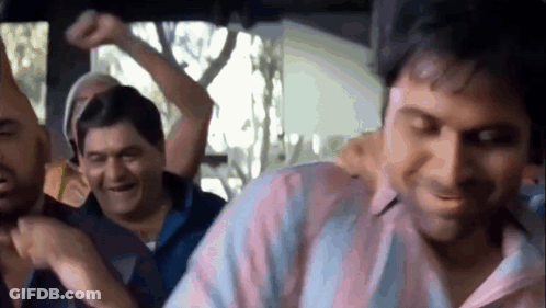 A Group Of Men Are Sitting In A Car Laughing And Dancing . GIF