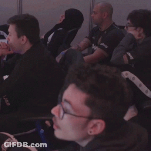 A Group Of Men Are Sitting In A Room And One Of Them Has A Shirt That Says Uae On It GIF