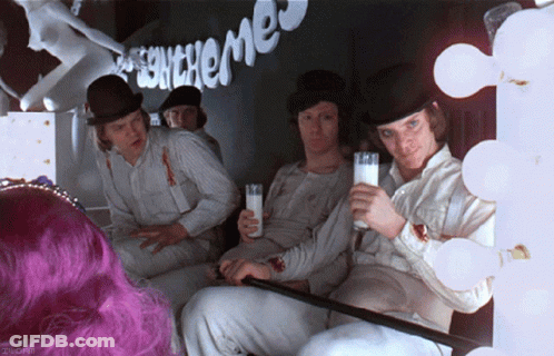 A Group Of Men Are Sitting In Front Of A Sign That Says ' Echemes ' On It GIF