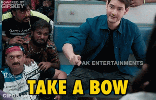 A Group Of Men Are Sitting On A Bus And One Of Them Is Pointing At The Camera And Says " Take A Bow " GIF