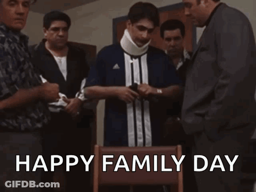 A Group Of Men Are Standing Around A Man With A Neck Brace And The Words Happy Family Day Written On The Bottom GIF