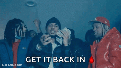 A Group Of Men Are Standing In A Dark Room With The Words " Get It Back In " On The Bottom Right GIF