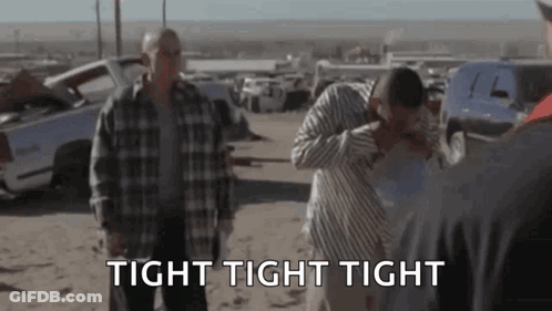 A Group Of Men Are Standing In A Field With The Words `` Tight Tight Tight '' In The Foreground . GIF