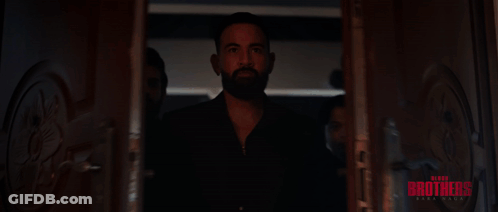 A Group Of Men Are Standing In A Hallway With The Word Brothers Written On The Bottom GIF