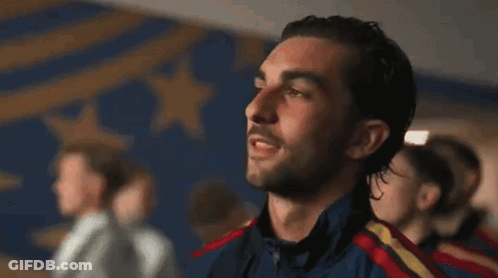 A Group Of Men Are Standing In A Line With Their Eyes Closed And Their Mouths Open . GIF