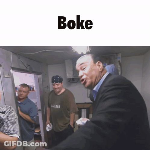 Men Standing In Room With Boke Text GIF