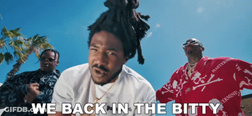 A Group Of Men Are Standing In Front Of A Blue Sky With The Words " We Back In The Bitty " GIF