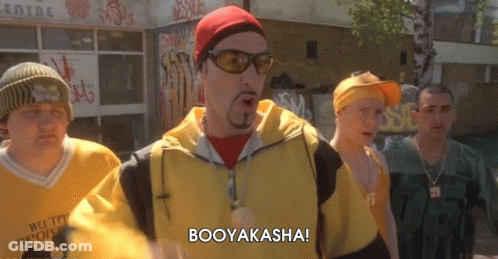 A Group Of Men Are Standing In Front Of A Building And One Of Them Is Saying Booyakasha GIF