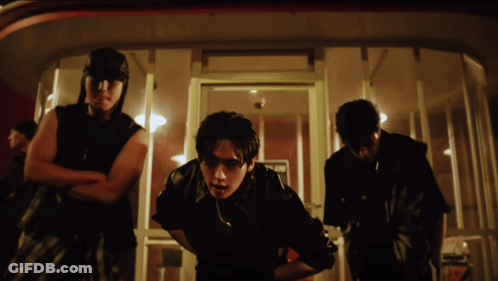 A Group Of Men Are Standing In Front Of A Door That Says No Parking GIF