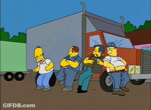 A Group Of Men Are Standing In Front Of A Semi Truck GIF