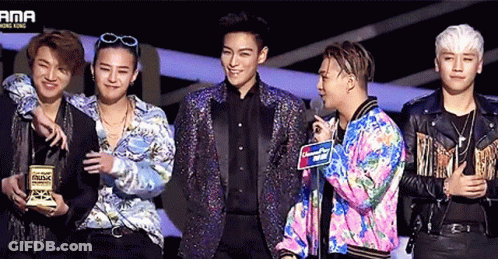 A Group Of Men Are Standing In Front Of A Sign That Says Ama Hong Kong GIF