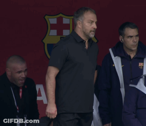 A Group Of Men Are Standing In Front Of A Sign That Says Fcb GIF