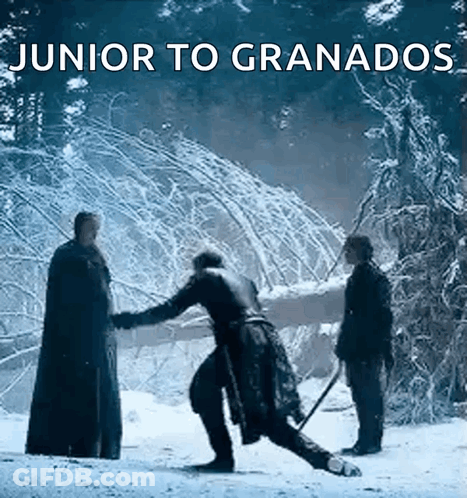 A Group Of Men Are Standing In The Snow With The Words Junior To Granados Above Them GIF