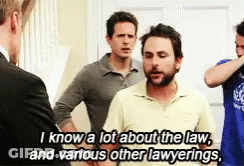 Men Standing Next To Each Other Talking About Law GIF
