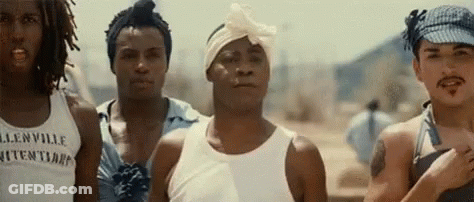 A Group Of Men Are Standing Next To Each Other And One Of Them Is Wearing A Bandana On His Head . GIF