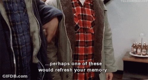 A Group Of Men Are Standing Next To Each Other And One Of Them Is Wearing A Plaid Shirt And A Jacket . GIF