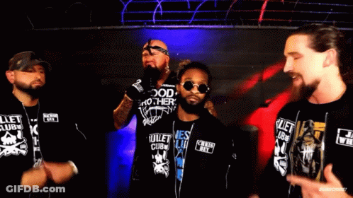 A Group Of Men Are Standing Next To Each Other And One Of Them Is Wearing A Shirt That Says I Know . GIF
