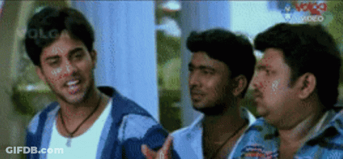 A Group Of Men Are Standing Next To Each Other And One Of Them Is Wearing A White Shirt GIF