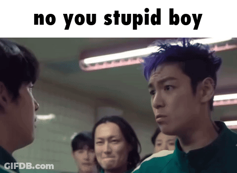 A Group Of Men Are Standing Next To Each Other In A Room And One Of Them Has Blue Hair . GIF