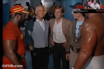 A Group Of Men Are Standing Next To Each Other In A Room And Talking To Each Other GIF