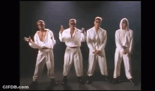 A Group Of Men Are Standing Next To Each Other On A Stage And Dancing . GIF