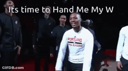 A Group Of Men Are Standing Next To Each Other On A Stage . GIF