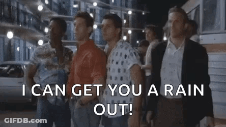A Group Of Men Are Standing Next To Each Other On A Street And Talking . GIF