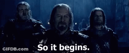 A Group Of Men Are Standing Next To Each Other With The Words `` So It Begins '' Written On The Bottom . GIF