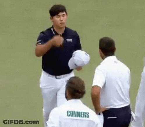 A Group Of Men Are Standing On A Golf Course And One Of Them Is Wearing A Shirt That Says Conners . GIF
