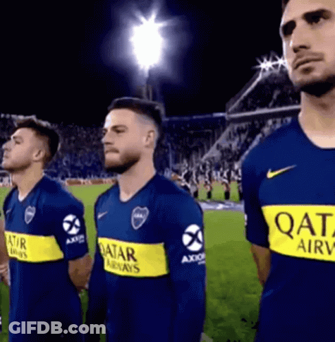 A Group Of Men Are Standing On A Soccer Field Wearing Qatar Airways Shirts . GIF