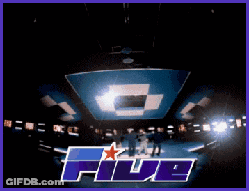 A Group Of Men Are Standing On A Stage In Front Of A Sign That Reads Five GIF