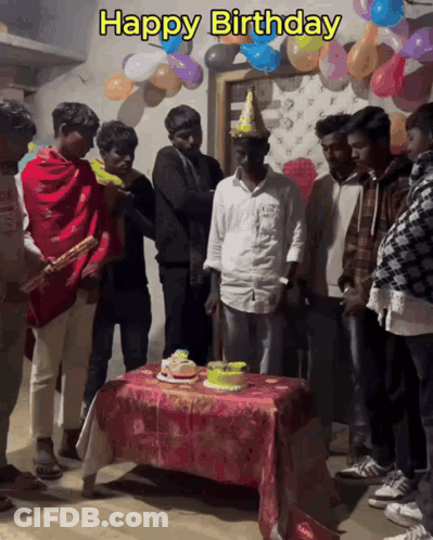 A Group Of Men Celebrate A Birthday With Balloons And A Cake GIF