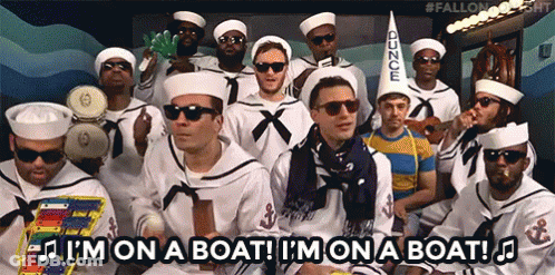 A Group Of Men Dressed As Sailors With The Words I 'M On A Boat Below Them GIF