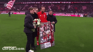 A Group Of Men Holding A Sign That Says 500 GIF