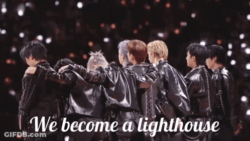 A Group Of Men Huddled Together With The Words " We Become A Lighthouse " On The Bottom GIF